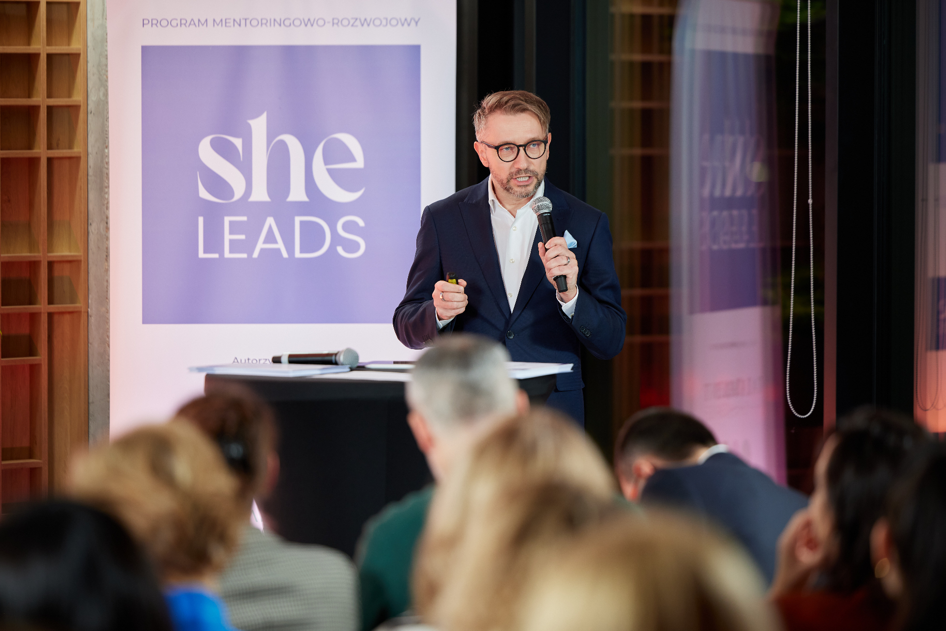 Andrew Wrobel speaking at She Leads Poland